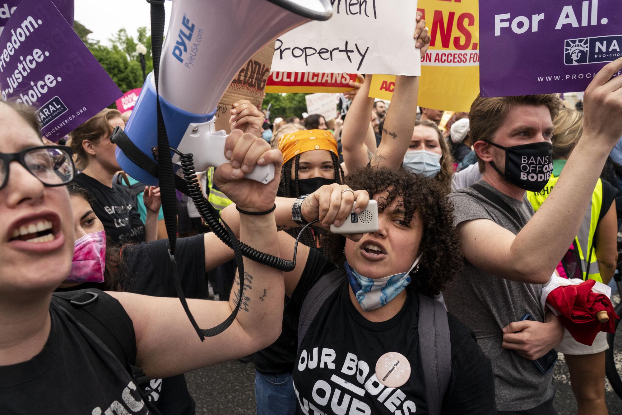  Abortion rights activists shout at antiabortion activists.