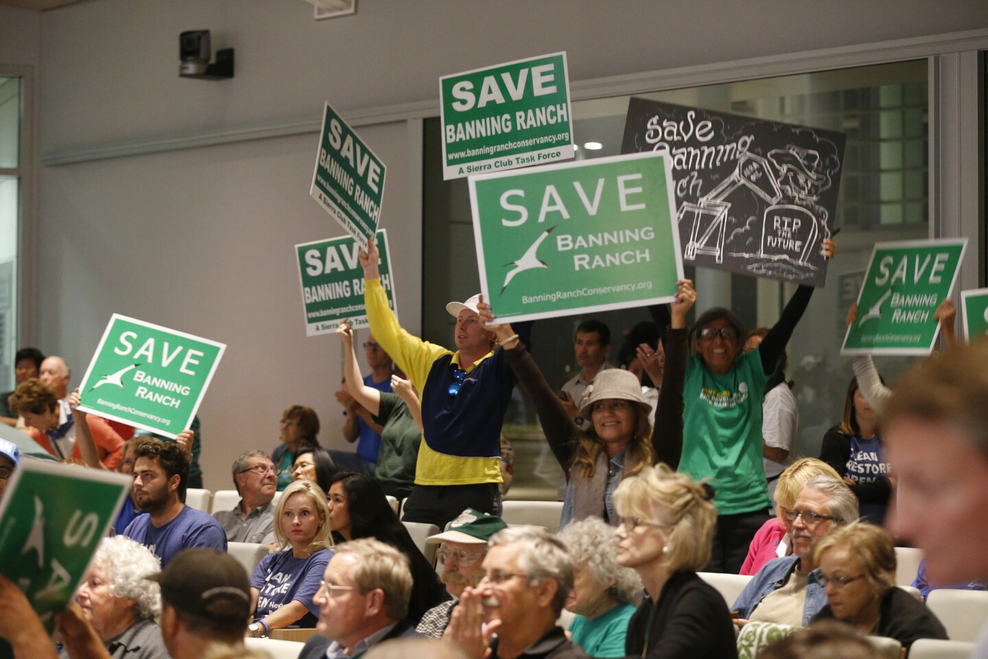 Opponents of the Newport Banning Ranch project celebrate after the Coastal Commission vote.