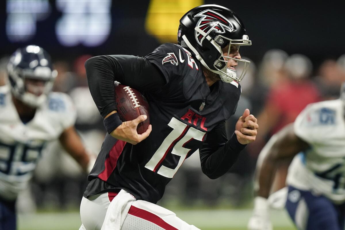 Atlanta Falcons quarterback Feleipe Franks (15) runs the ball out of the pocket against the Tennessee Titans during the second half of a preseason NFL football game, Friday, Aug. 13, 2021, in Atlanta. (AP Photo/Brynn Anderson)