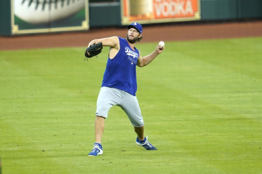 Los Angeles Dodgers pitcher Clayton Kershaw throws during batting practice before a baseball game against the Houston Astros Wednesday, July 29, 2020, in Houston. (AP Photo/David J. Phillip)