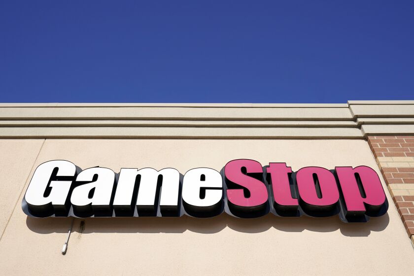 FILE - In this file photo, a GameStop sign is displayed above a store in Urbandale, Iowa, on Jan. 28, 2021. Shares of GameStop are falling before the market open on Thursday, June 8, 2023, as the video game company has terminated CEO Matthew Furlong and named Ryan Cohen as its executive chairman.(AP Photo/Charlie Neibergall, File)