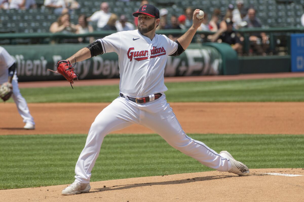 Cleveland Guardians starting pitcher Konnor Pilkington delivers against the Kansas City Royals during the first inning of a baseball game in Cleveland, Tuesday, June 1, 2022. (AP Photo/Phil Long)