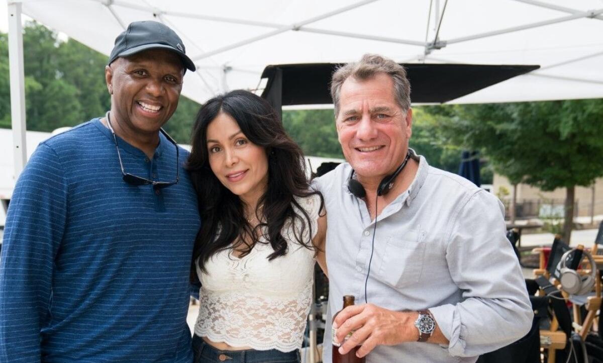 Movie writer/director Kim Bass, actress Claudia Zevallos and producer John Cappetta on the set of "A Snowy Day in Oakland."