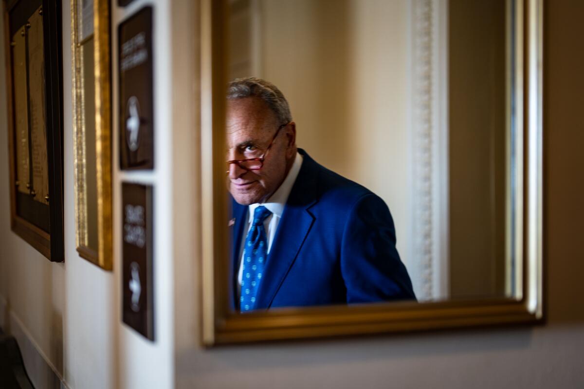 A man is reflected in a mirror.