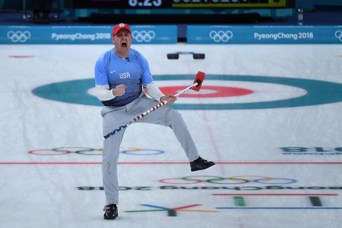 John Shuster of the United States celebrates a point during the gold-medal game in men's curling.