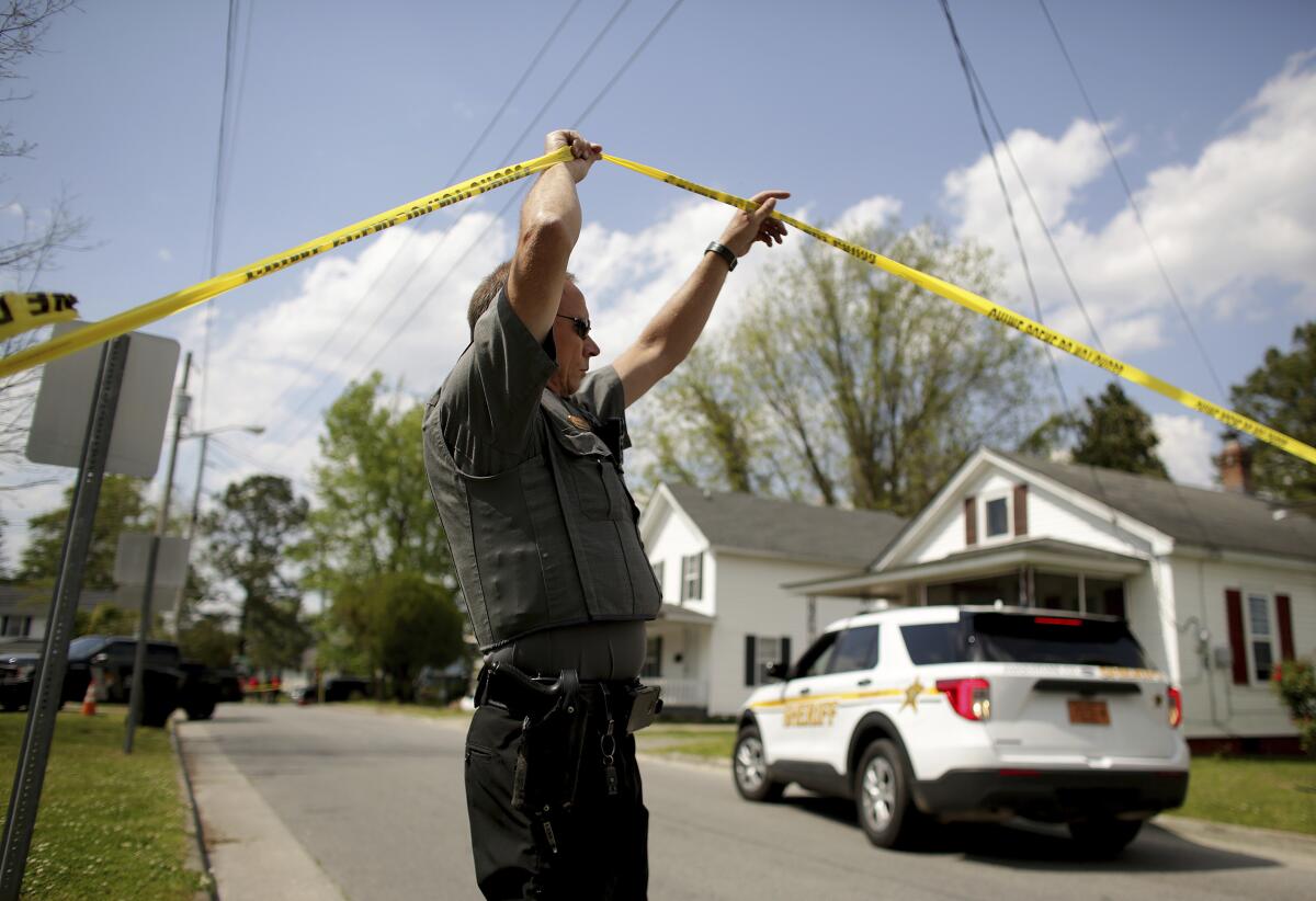 A law enforcement official investigates the scene of a shooting in North Carolina