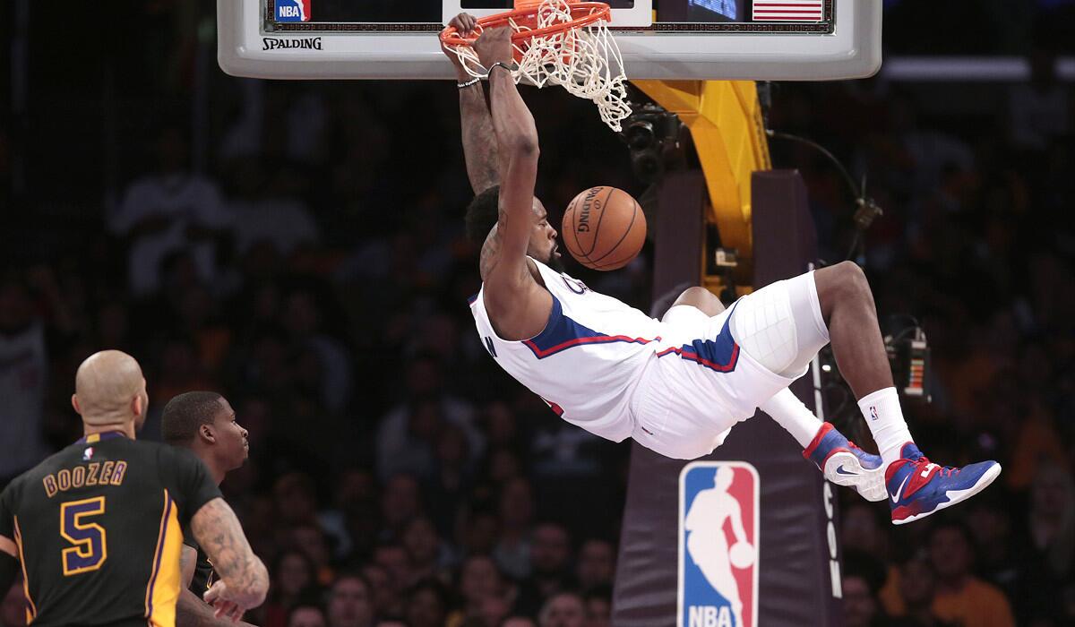 Clippers center DeAndre Jordan slams two points over Lakers defenders earlier in the season.