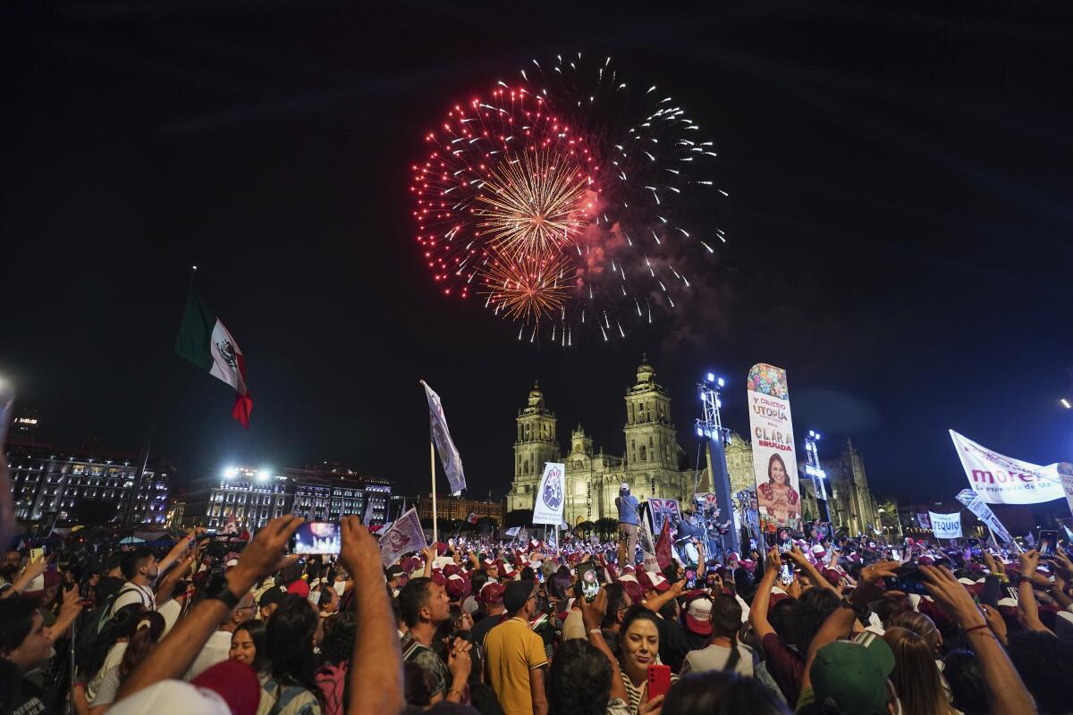 Fireworks go off over a cheering crowd in Mexico City.