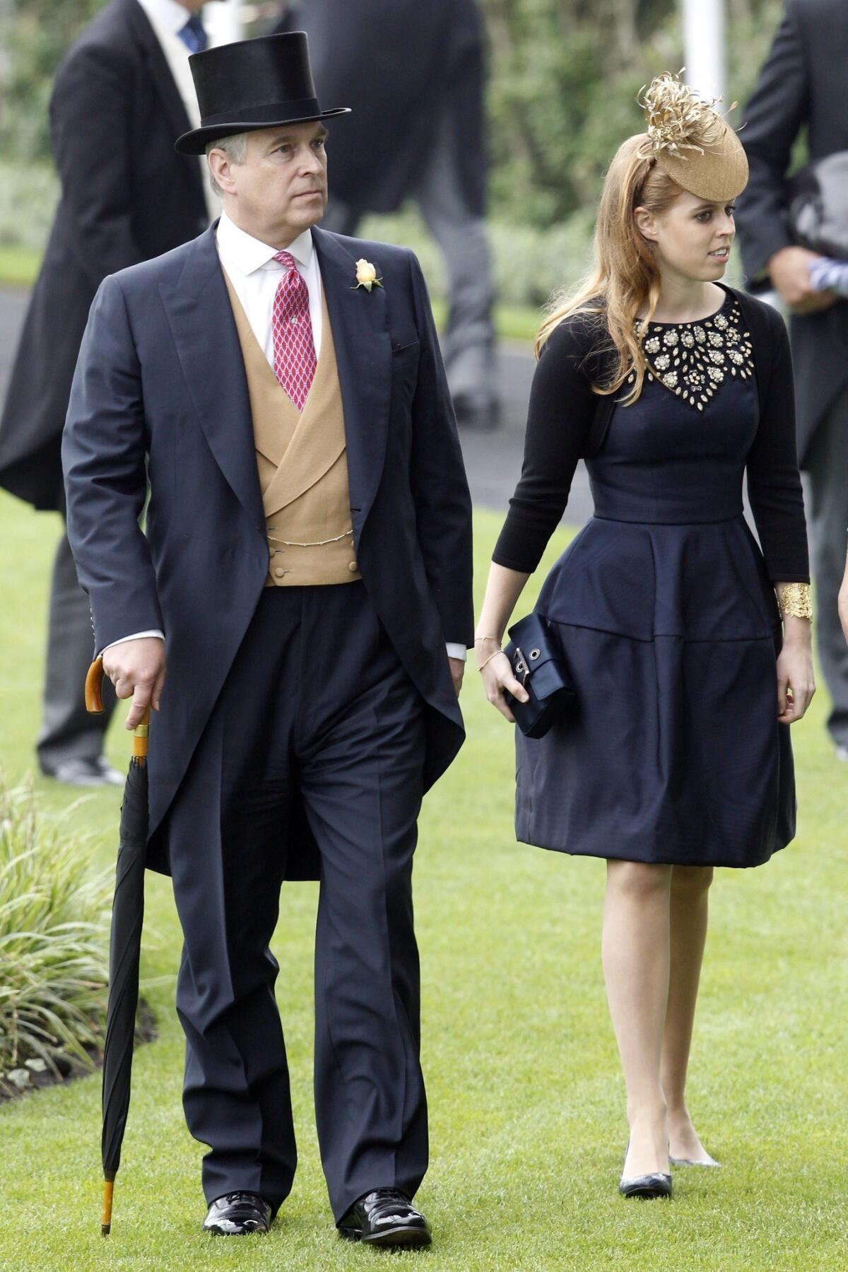 Britain's Prince Andrew, Duke of York, and his daughter Princess Beatrice arrive for the Ladies' Day of Royal Ascot in England. Ascot is well known for its strict dress code of hats.