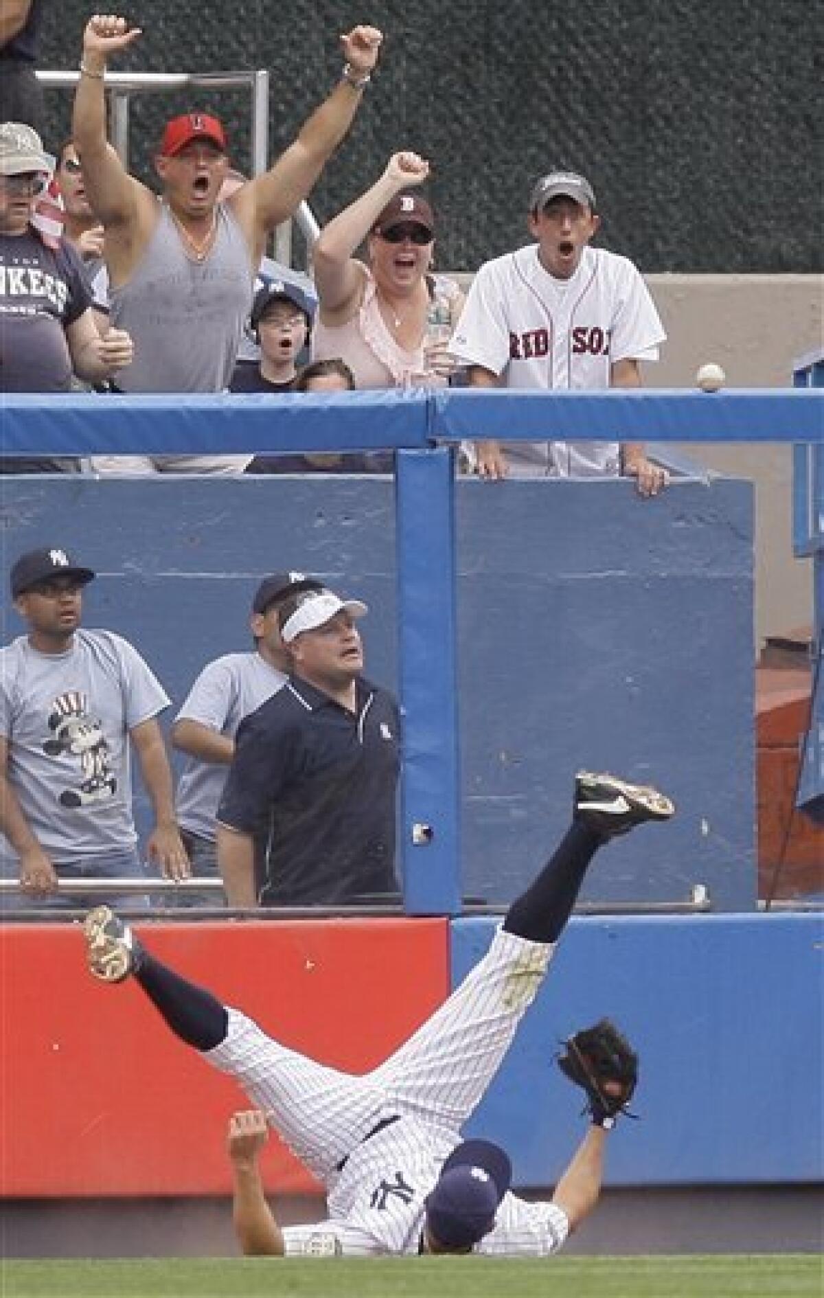 Boston Red Sox's Johnny Damon scores on a sacrifice fly by Manny