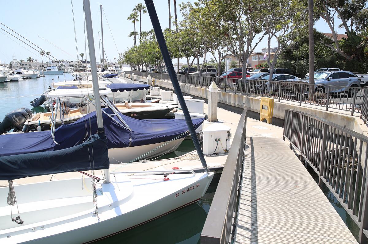 Pathways lead to the boats docked in the Balboa Yacht Basin marina in Newport Harbor in Newport Beach.
