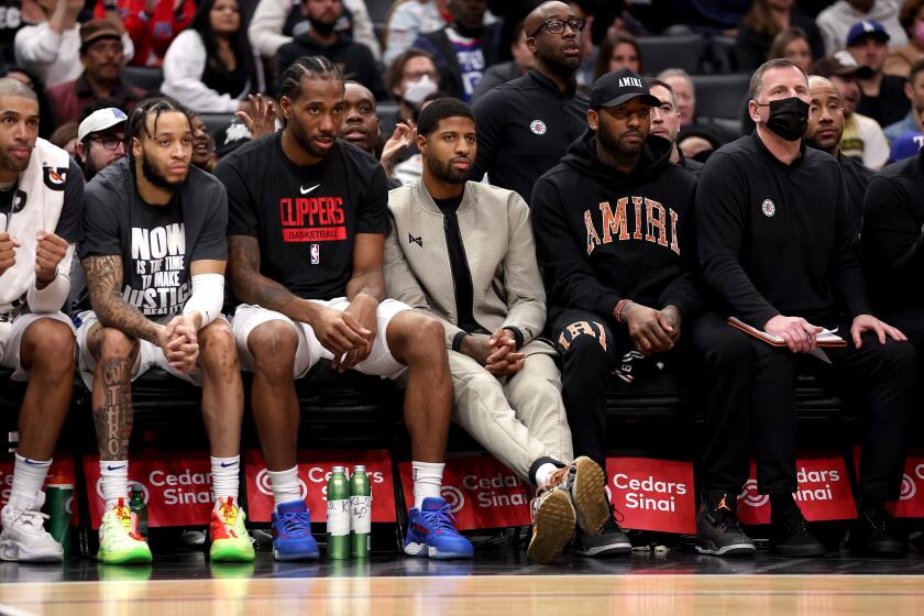 LOS ANGELES, CALIFORNIA - JANUARY 15: Paul George #3 of the LA Clippers looks on from the bench.
