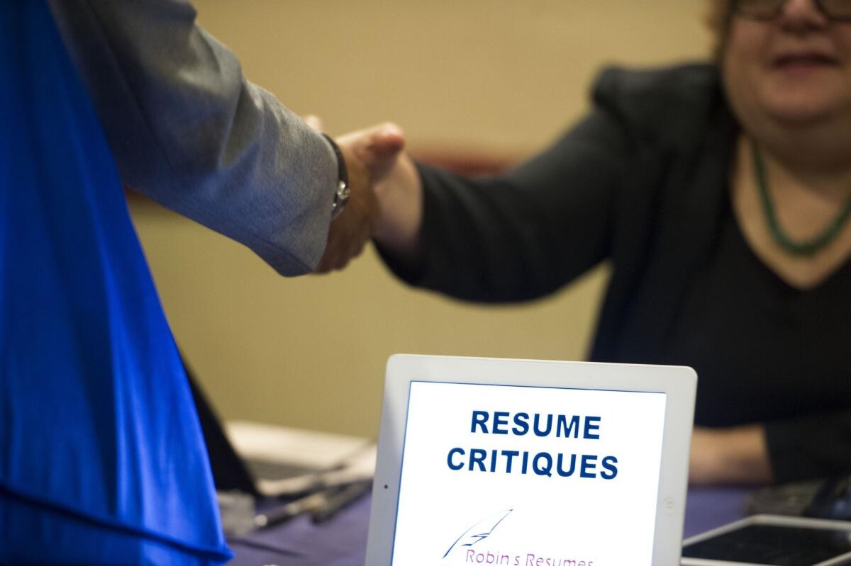 Though the nation added 195,000 jobs in June, the number of people working part-time rose sharply last month to 8.3 million. Above, a job seeker stops at a table at an Atlanta job fair.