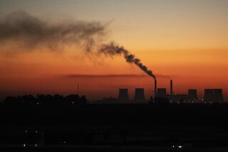 FILE - A coal-fired power station in Witbank, South Africa , Monday, Oct. 11, 2021. South Africa's ever-worsening power crisis, in which homes and businesses go without electricity for up to 10 hours per day, is strangling Africa's most developed economy. President Cyril Ramaphosa hopes that by creating a new Cabinet post, electricity minister, his government will be able to curb the rampant corruption and mismanagement that have put the country in the dark. Ramaphosa is to name the new minister in a reshuffle later Monday, March 6, 2023. (AP Photo/Themba Hadebe, File)