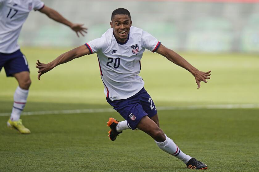 FILE - United States Reggie Cannon celebrates after scoring against Costa Rica during an international friendly soccer match in Sandy, USA, Wednesday, June 9, 2021. Reggie Cannon has joined Queen’s Park Rangers on a four-year contract. Cannon was allowed to move outside of the transfer window because he was a free agent after leaving Portuguese club Boavista in June. (AP Photo/Rick Bowmer, File)