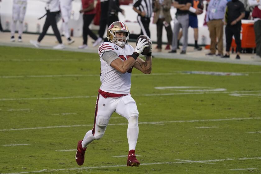 San Francisco 49ers tight end George Kittle (85) runs toward the end zone to score a touchdown against the Los Angeles Rams during the first half of an NFL football game in Santa Clara, Calif., Sunday, Oct. 18, 2020. (AP Photo/Tony Avelar)