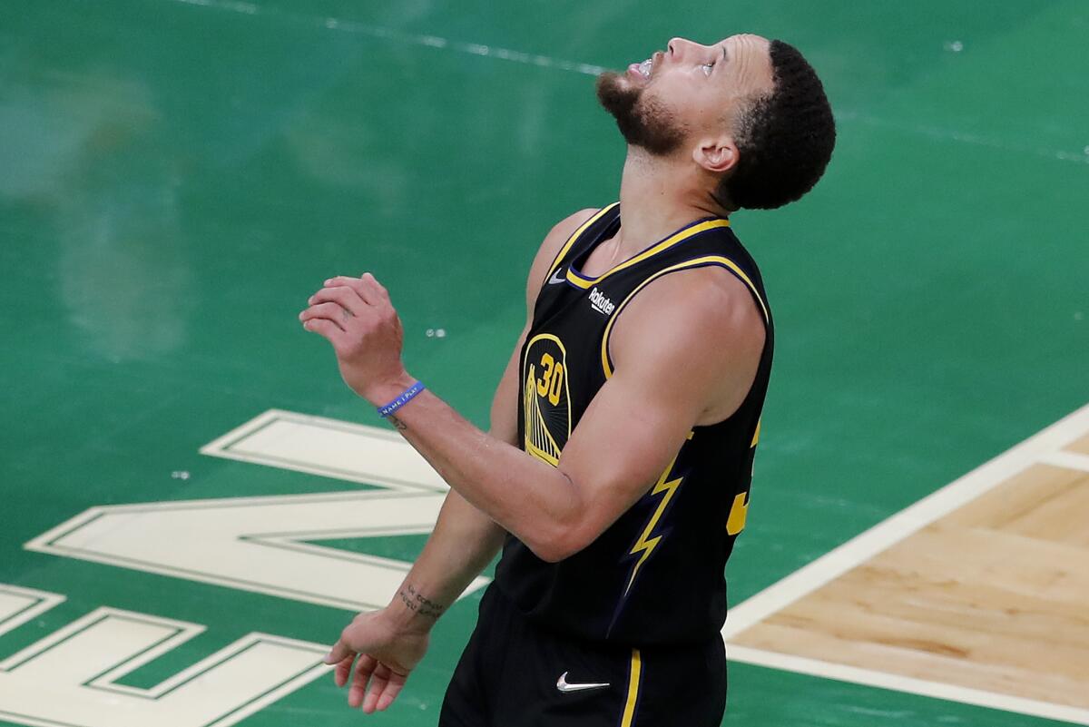Golden State Warriors guard Stephen Curry (30) reacts during the fourth quarter of Game 4 of basketball's NBA Finals against the Boston Celtics, Friday, June 10, 2022, in Boston. (AP Photo/Michael Dwyer)