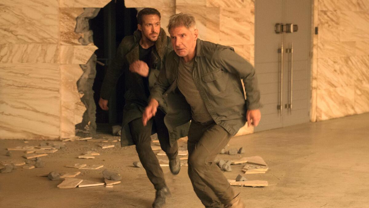 This image released by warner Bros. Pictures shows Ryan Gosling, left, and Harrison Ford in a scene from "Blade Runner 2049."