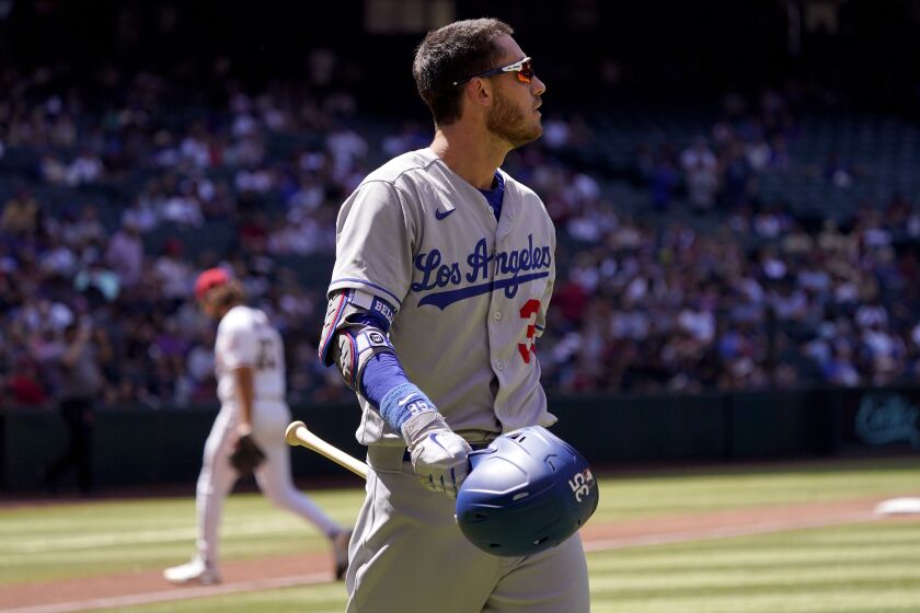 The Dodgers' Cody Bellinger walks to the dugout after striking out against the Diamondbacks 