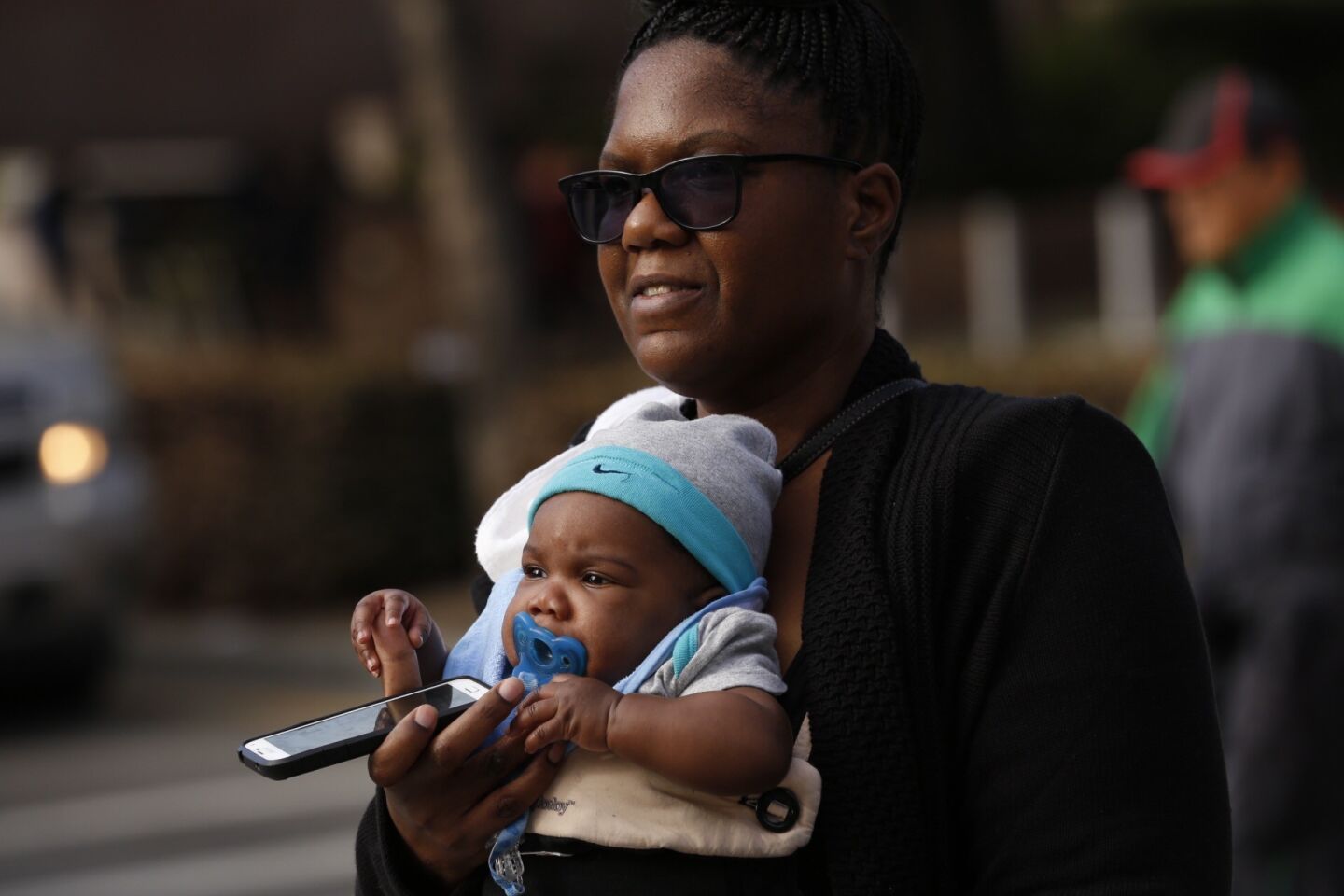 Four-month-old Kwasi Youngblood is carried by his mother, Darchelle Youngblood, in downtown Los Angeles on Jan. 4. Youngblood said she is ready for the cold and wet weather predicted for Southern California.
