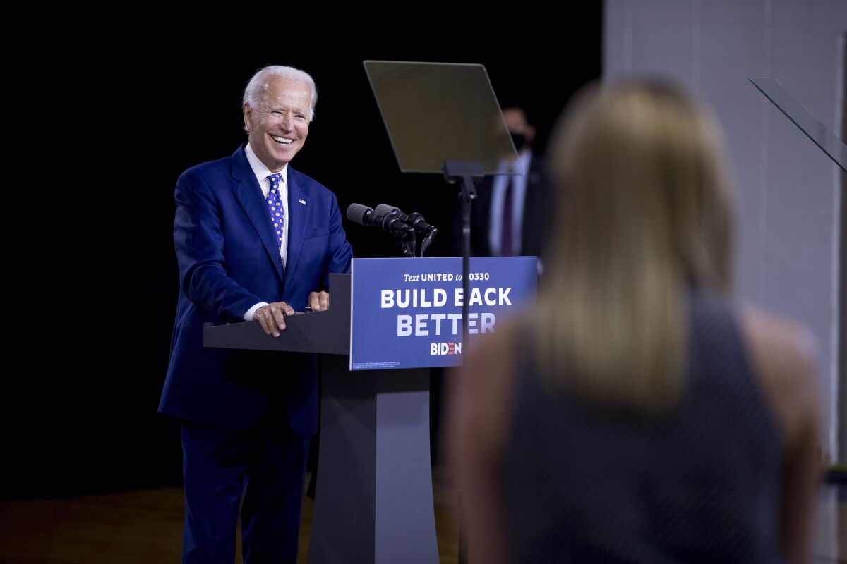 Democratic presidential candidate former Vice President Joe Biden smiles as he takes a question from a reporter at a campaign event at the William "Hicks" Anderson Community Center in Wilmington, Del., Tuesday, July 28, 2020.(AP Photo/Andrew Harnik)