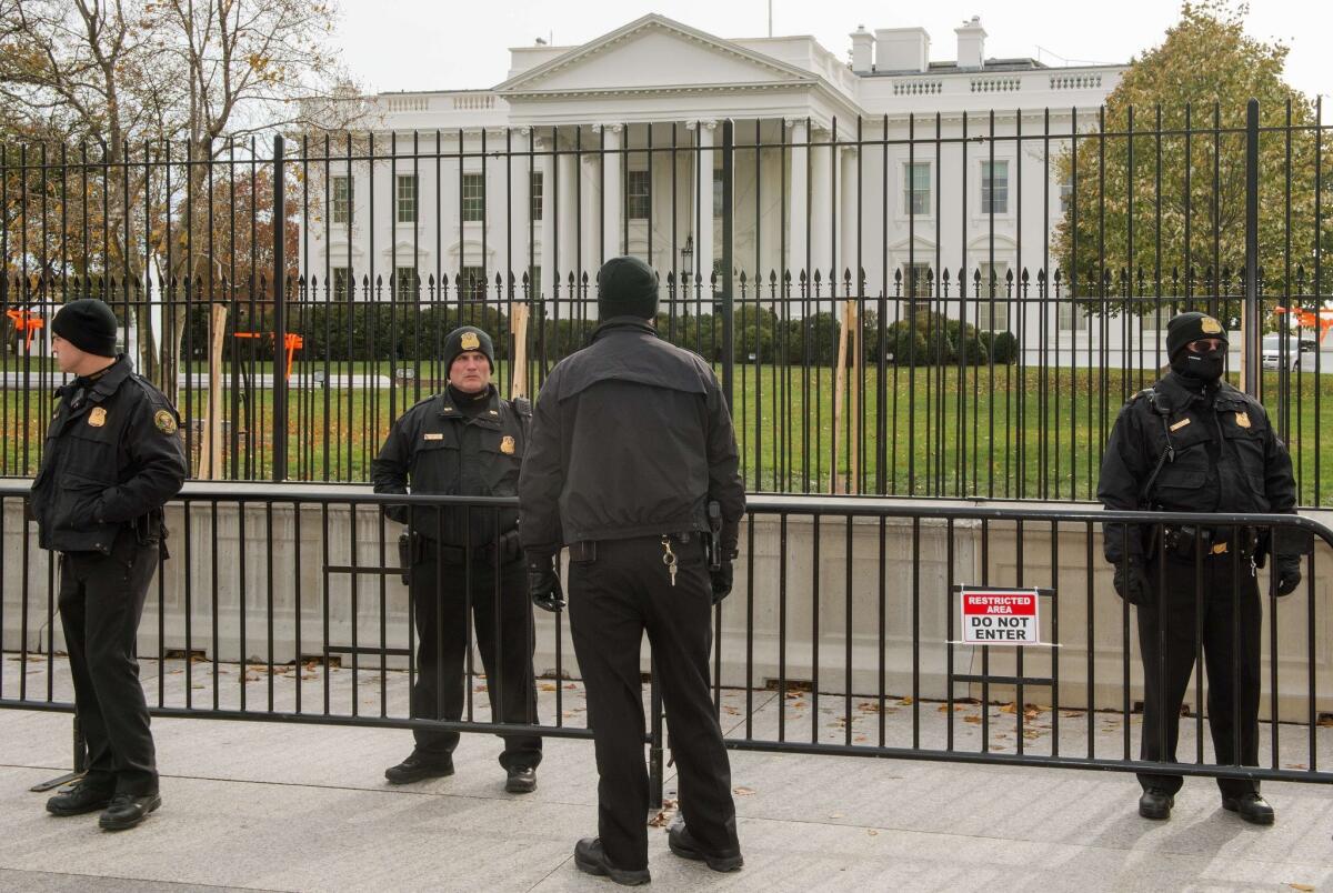 Secret Service agents stand guard in front of the White House on Nov. 19.