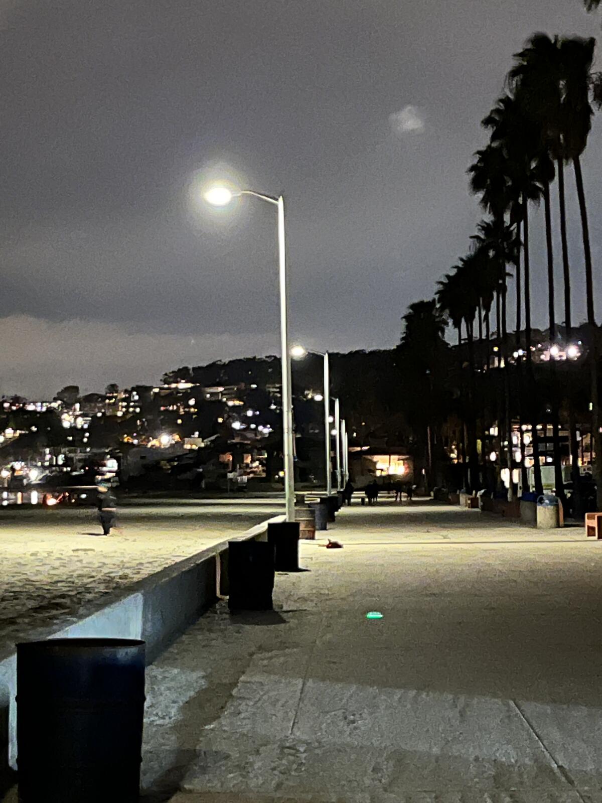 In this photo taken March 3, all the lights are on along the La Jolla Shores boardwalk after being dark for months.