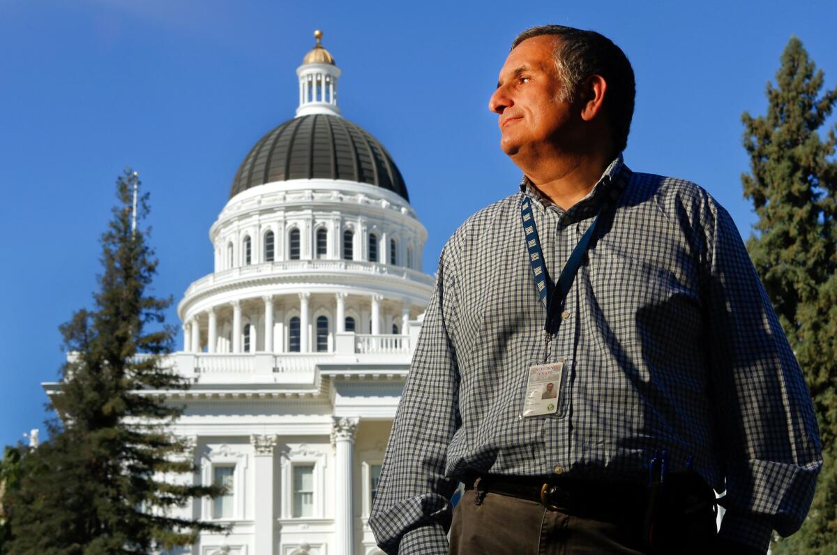 SACRAMENTO, CA-AUGUST 30, 2013: Irwin Nowick, Senior Consultant of the California State Senate, is photographed in front of the California Capitol in Sacramento on August 30, 2013. Nowick is an expert in chaptering, an obscure but critical process of sifting through legislation to find errors. (Mel Melcon/Los Angeles Times)