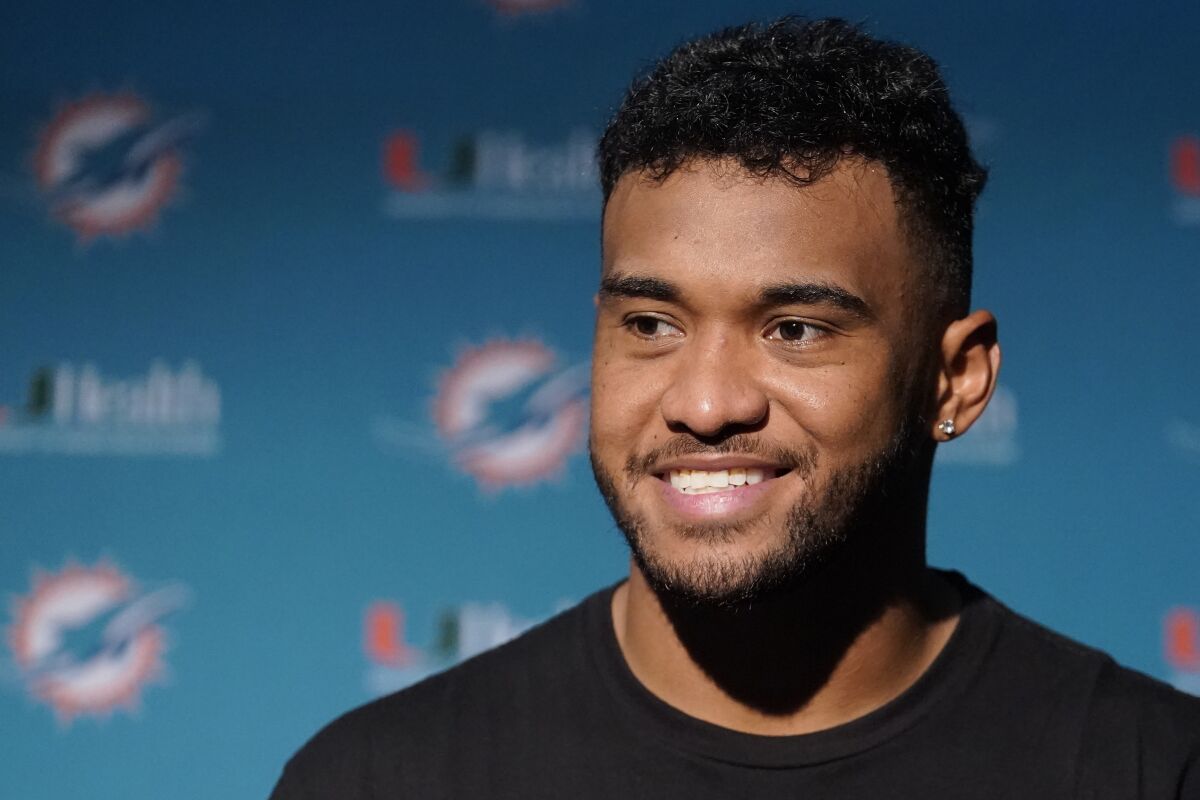 Miami Dolphins quarterback Tua Tagovailoa smiles during a news conference after a win over the New England Patriots in an NFL football game, Sunday, Sept. 12, 2021, in Foxborough, Mass. (AP Photo/Steven Senne)