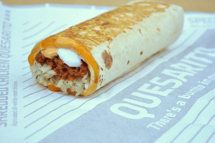 A Taco Bell quesarito made with seasoned ground beef, sour cream, chipotle sauce and rice wrapped in a quesadilla filled with melted cheese.