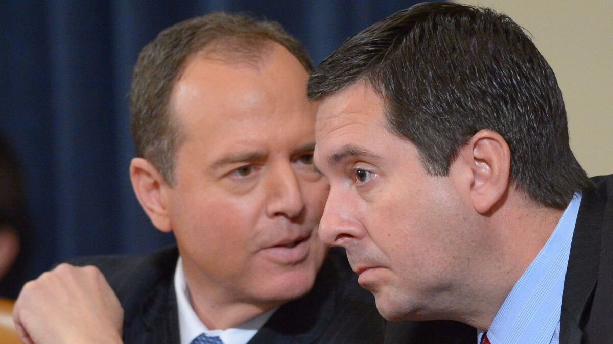 Reps. Adam B. Schiff, left, and Devin Nunes during a House Intelligence Committee hearing. (Mandel Ngan / AFP-Getty Images)