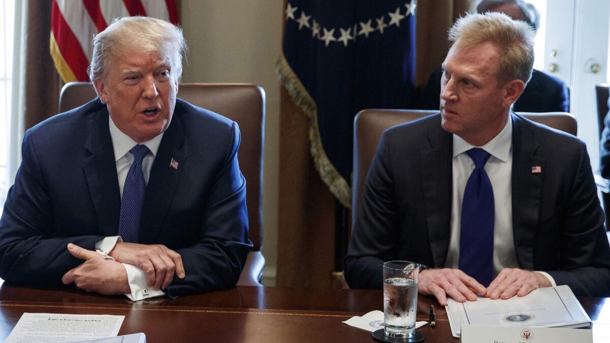 Deputy Secretary of Defense Patrick Shanahan, right, listens as President Trump speaks during a Cabinet meeting at the White House on April 9, 2018.