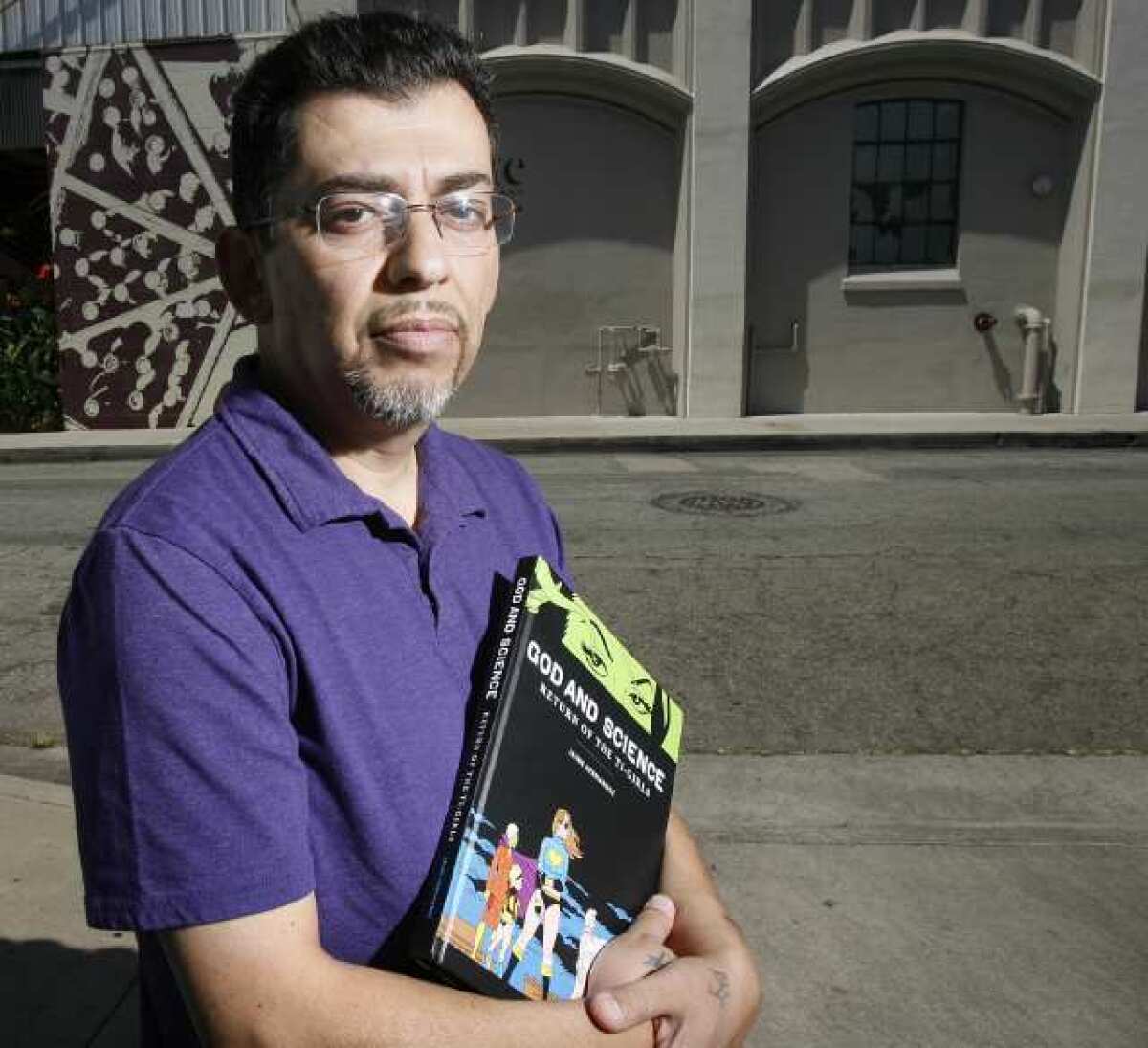 Comic book illustrator Jaime Hernandez, with his new book 'God and Science: Return of the Ti-Girls,' in Glendale.