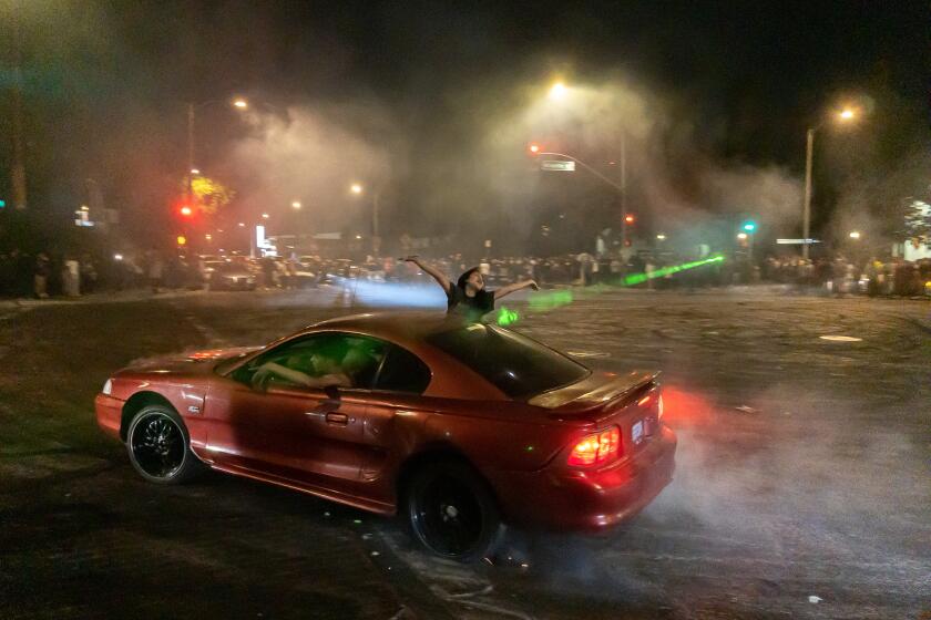 Compton Boulevard and Atlantic Avenue in East Compton are blocked off during an early-morning street takeover. 