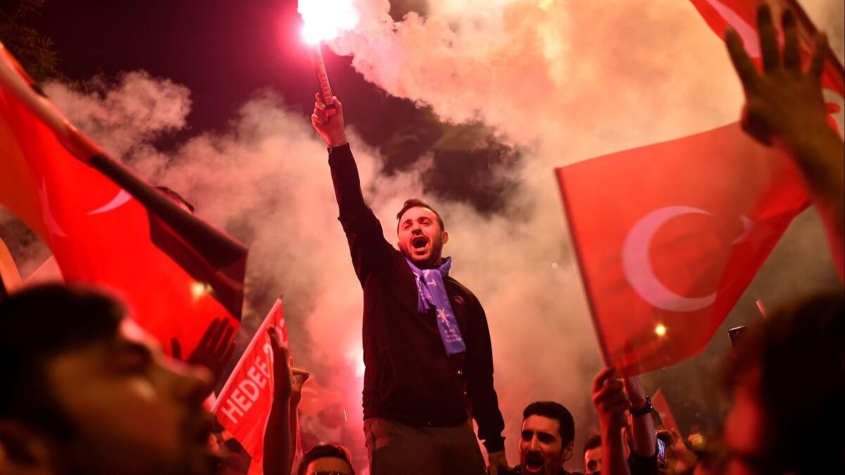 People rally outside the headquarters of President Recep Tayyip Erdogan's Justice and Development Party in Istanbul, Turkey, after the election.