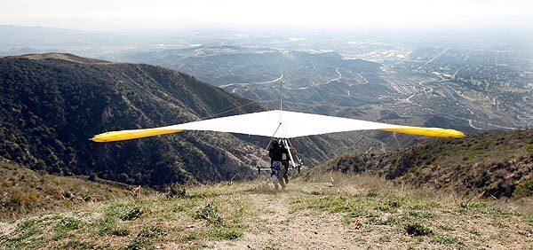 On a hazy afternoon, Joe Greblo gets a running start and leaps off Kagel Mountain for a flight over Sylmar. As the age of a typical "hangie" soars into the 60s and 70s, many worry less about their own survival and more about the future of the sport they love and helped invent in the sun-baked mountains around Los Angeles.