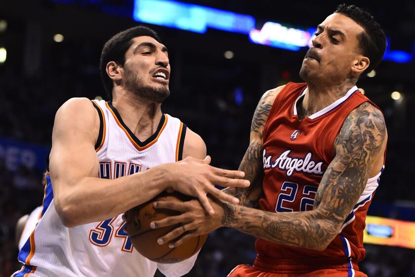 Clippers forward Matt Barnes fights with Oklahoma City center Enes Kanter during a game March 11 at Chesapeake Energy Arena.