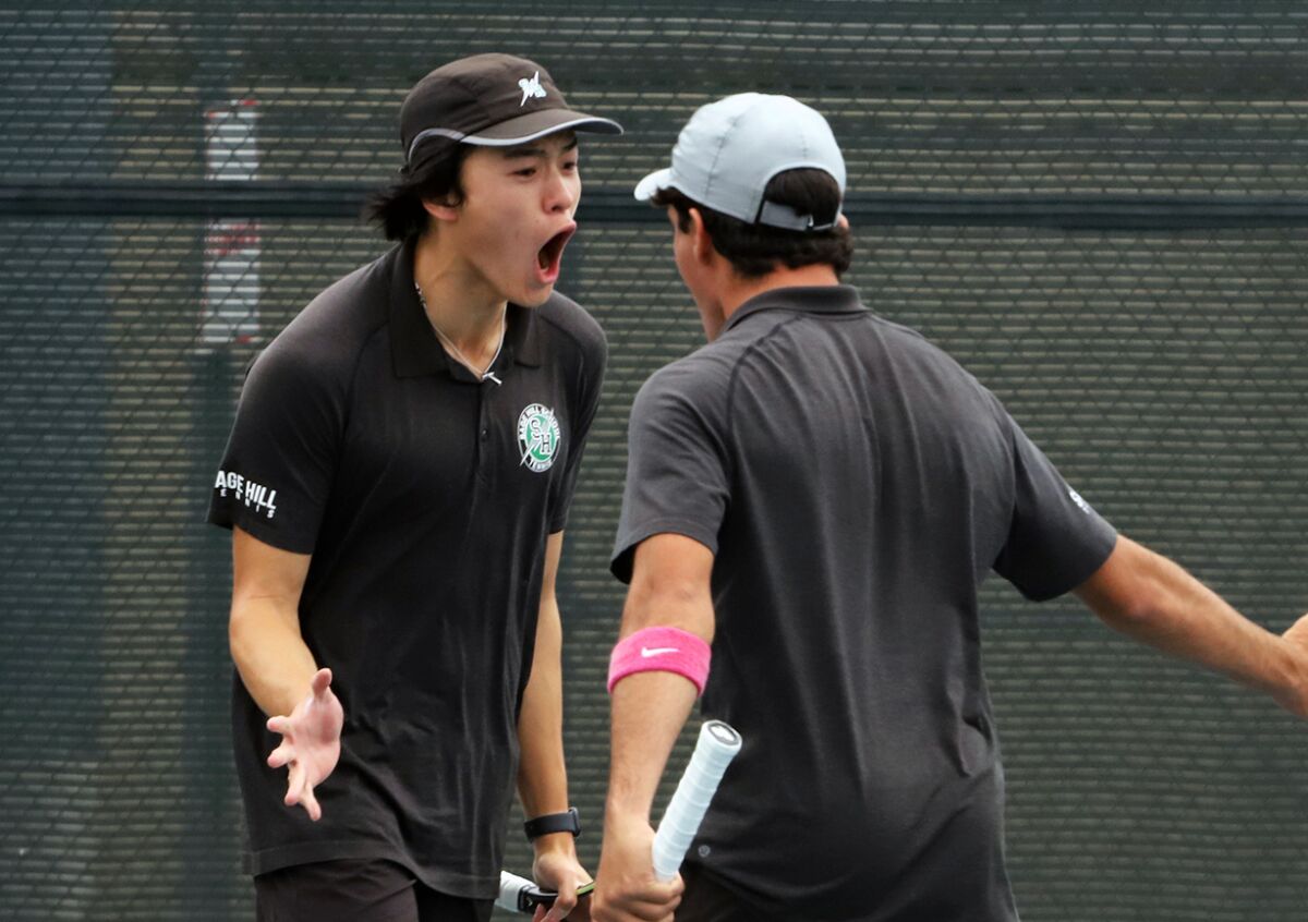 Sage Hill's No. 1 doubles players Eddie Yang, left, and Shaan Sakraney celebrate after winning a set.