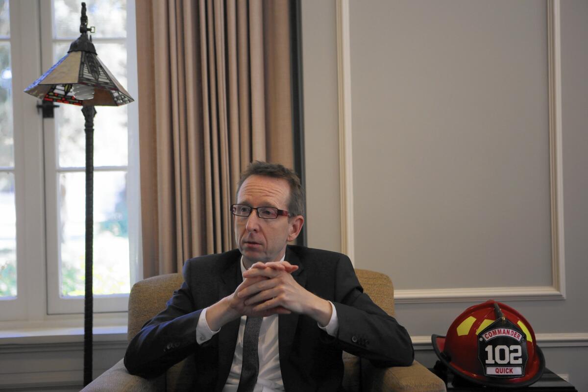 USC Provost Michael Quick in his campus office. The school has been embroiled in a dispute with UC San Diego over an Alzheimer's disease research project. "Hopefully, we will soon be able to work out things with UCSD and get back to being partners for better research," he said.