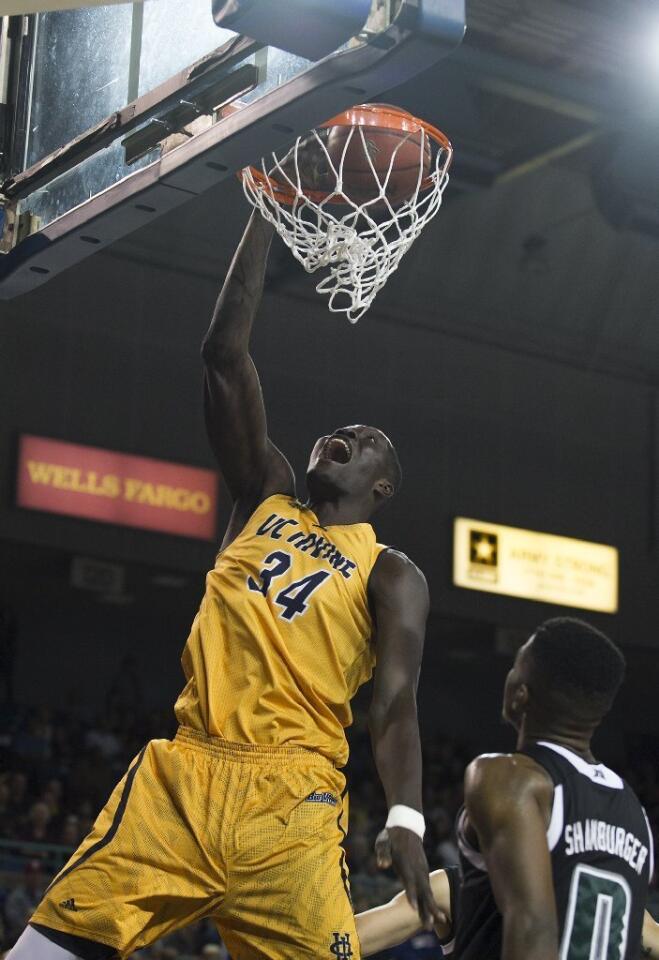 UC Irvine's Mamadou Ndiaye slam dunks during a game against Hawaii on Saturday.