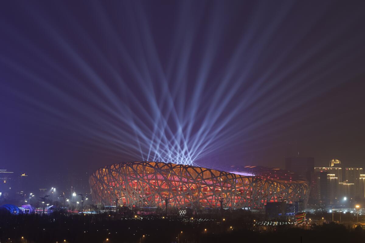 Lights shine during a rehearsal for the 2022 Winter Olympics opening ceremony on Jan. 30.