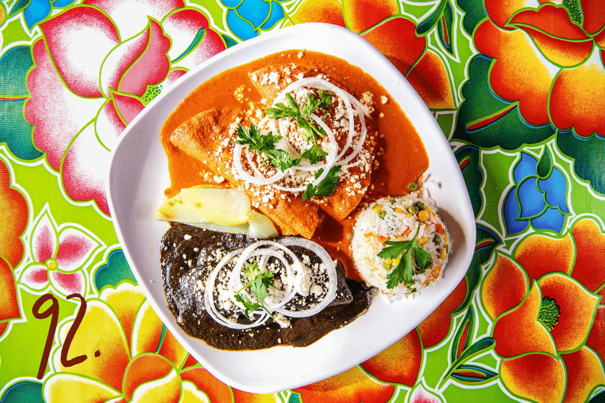 #92: Enchiladas, sauced with half mole negro and half coloradito, with a variety of filling options