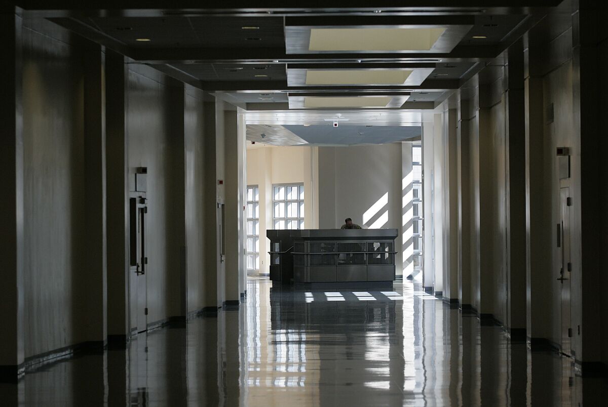 A view of a shadowed hallway at Coalinga State Hospital.