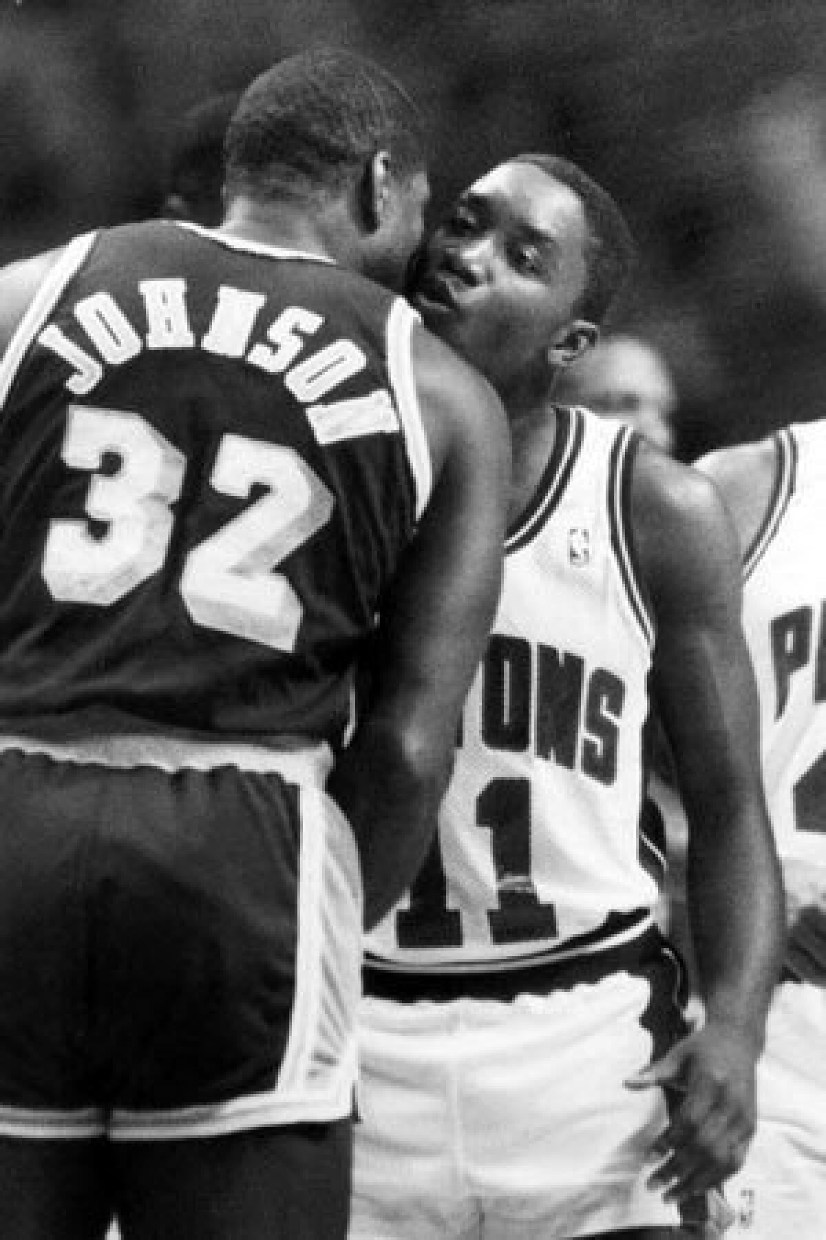 In this June 16, 1988 file photo, Detroit's Isiah Thomas, right, and Magic Johnson exchange their usual pregame kiss, back when they were friends.