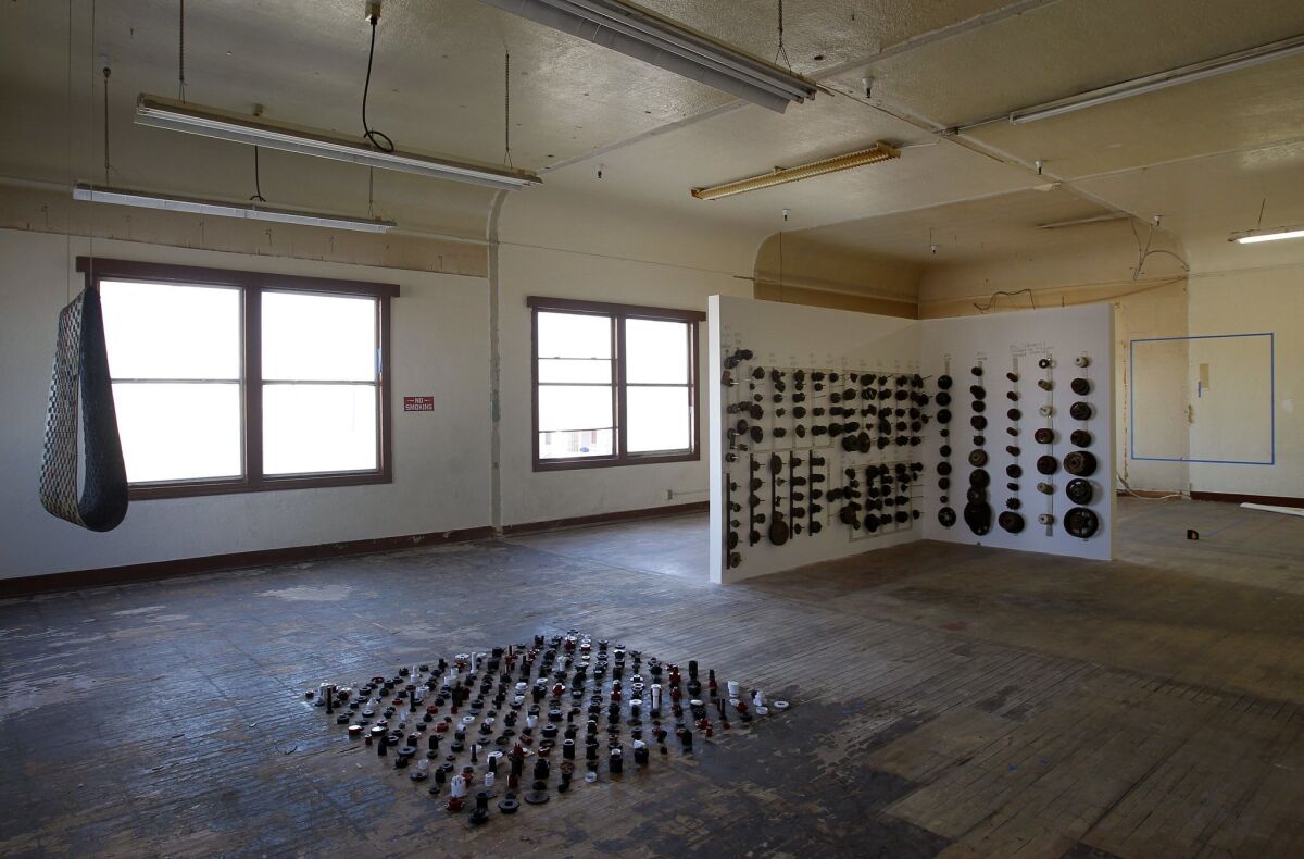 4 Installations' artists mined the leftover nuts, bolts and machinery from the building's bakery heritage for their art show. — K.C. Alfred