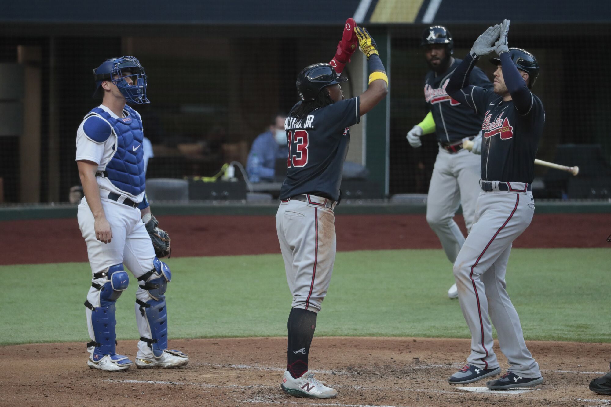 Atlanta's Freddie Freeman, right, celebrates with teammate Ronald Acuna Jr. after hitting a two-run home run.