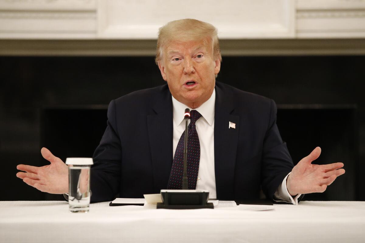 President Trump speaks with law enforcement officials Monday at the White House. 