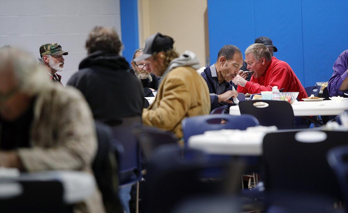 Guests eat at the annual Thanksgiving meal served at the Glendale Salvation Army on Wednesday, Nov. 27, 2019.