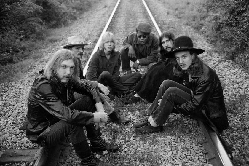 MACON, GA - MAY 5: Rock group The Allman Brothers (L-R) Duane Allman, Dickey Betts, Gregg Allman, Jai Johanny Johanson, Berry Oakley and Butch Trucks sit on some rairoad tracks on May 5, 1969 outside of Macon, Georgia. (Photo by Michael Ochs Archives/Getty Images)
