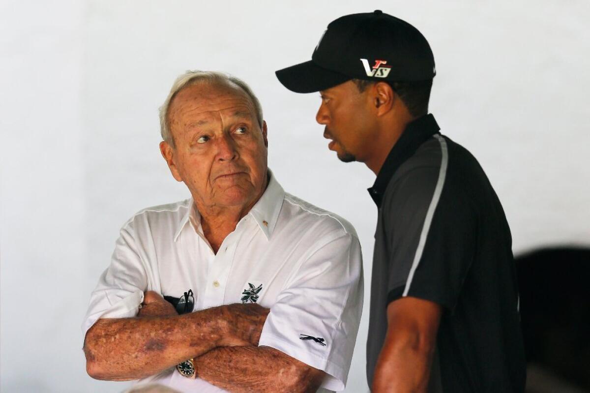 Tiger Woods talks with Arnold Palmer before his U.S. Open practice round at Pennsylvania's Merion Golf Club.